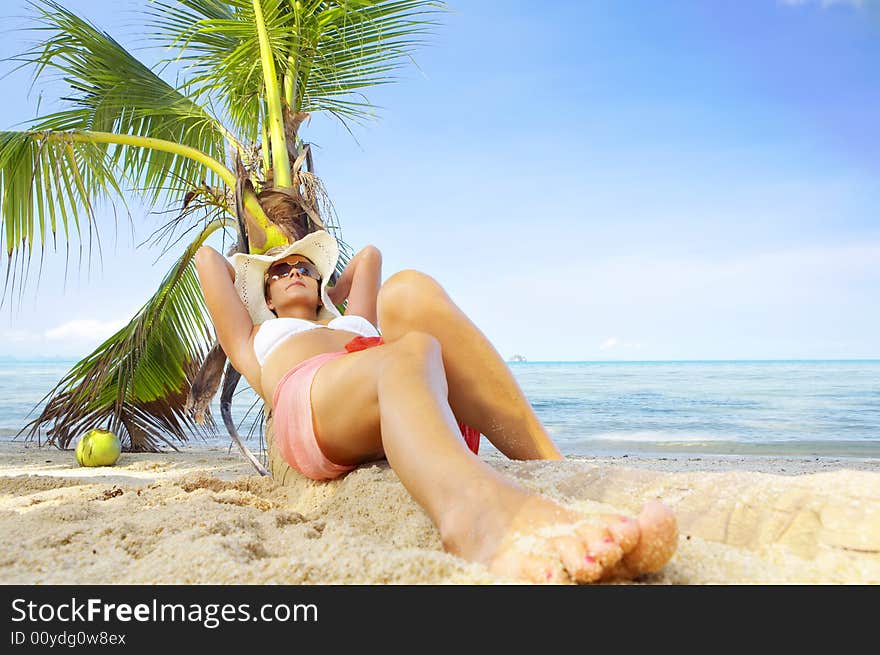 View of nice woman having fun on tropical beach. View of nice woman having fun on tropical beach