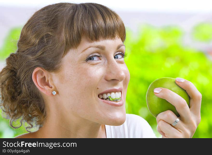 High key portrait of young woman with apple. High key portrait of young woman with apple