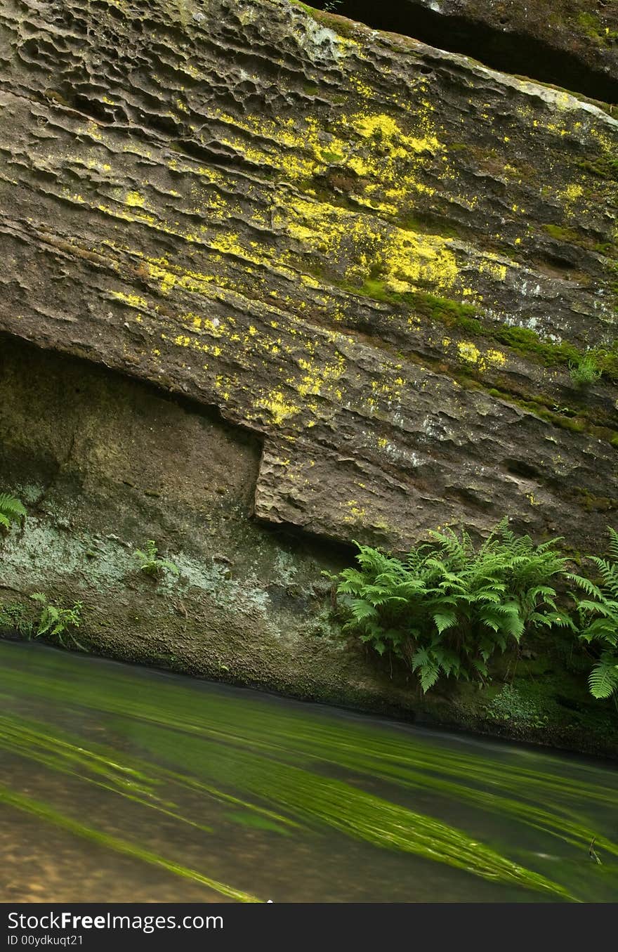 Rock with flowing water in national park Bohemian Switzerland. Rock with flowing water in national park Bohemian Switzerland