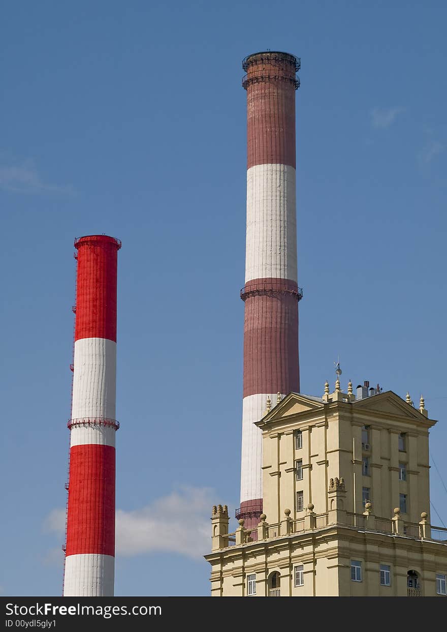 Red and white striped chimneys of a power station. Red and white striped chimneys of a power station