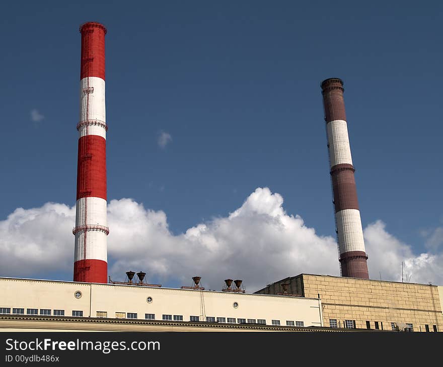 Red and white striped chimneys of a power station. Red and white striped chimneys of a power station