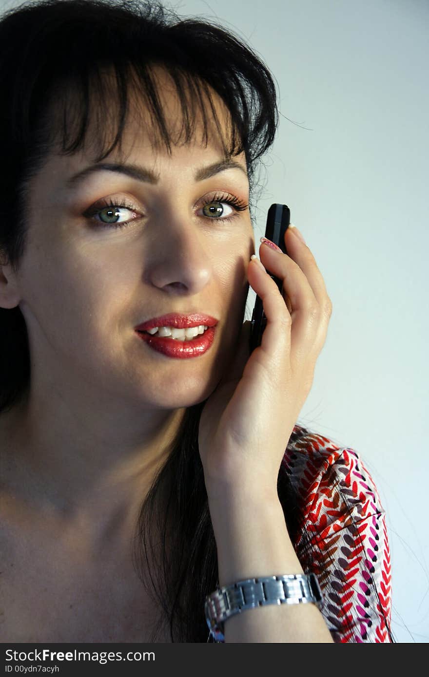 Young woman using her cellular phone