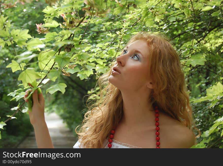 Beautiful red-head girl in woods. Beautiful red-head girl in woods