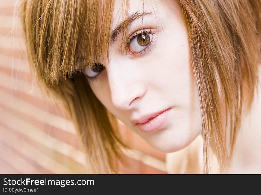 Beautiful blond portrait staring at camera. Beautiful blond portrait staring at camera.