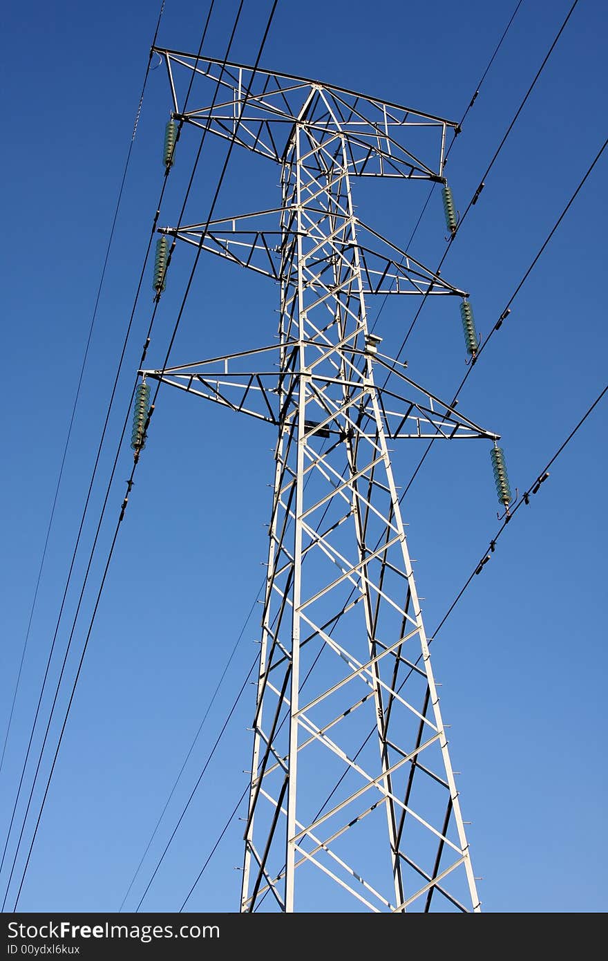 Electric cables and tower in the blue sky. Electric cables and tower in the blue sky.