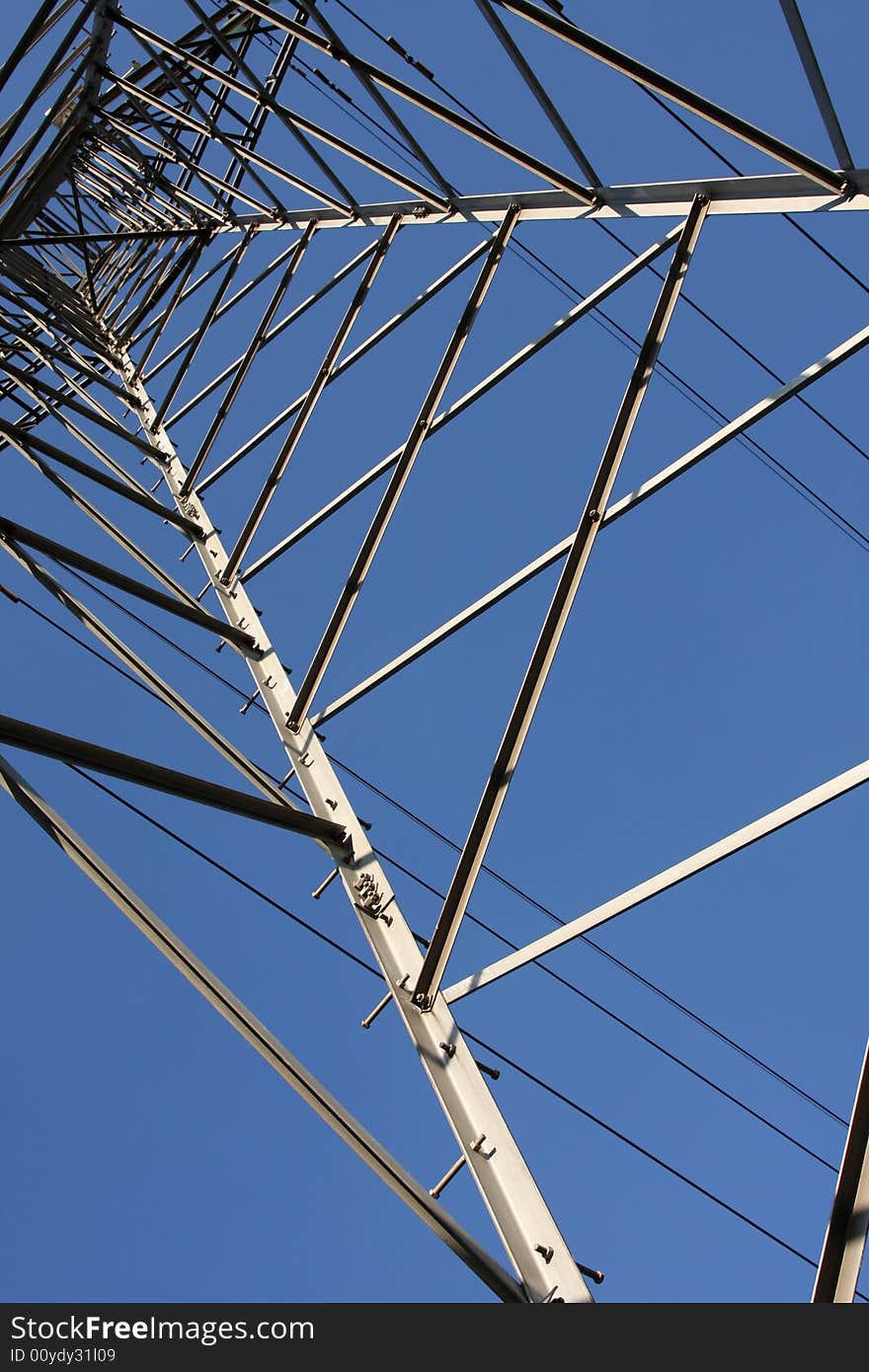 Electric cables and tower in the blue sky. Electric cables and tower in the blue sky.