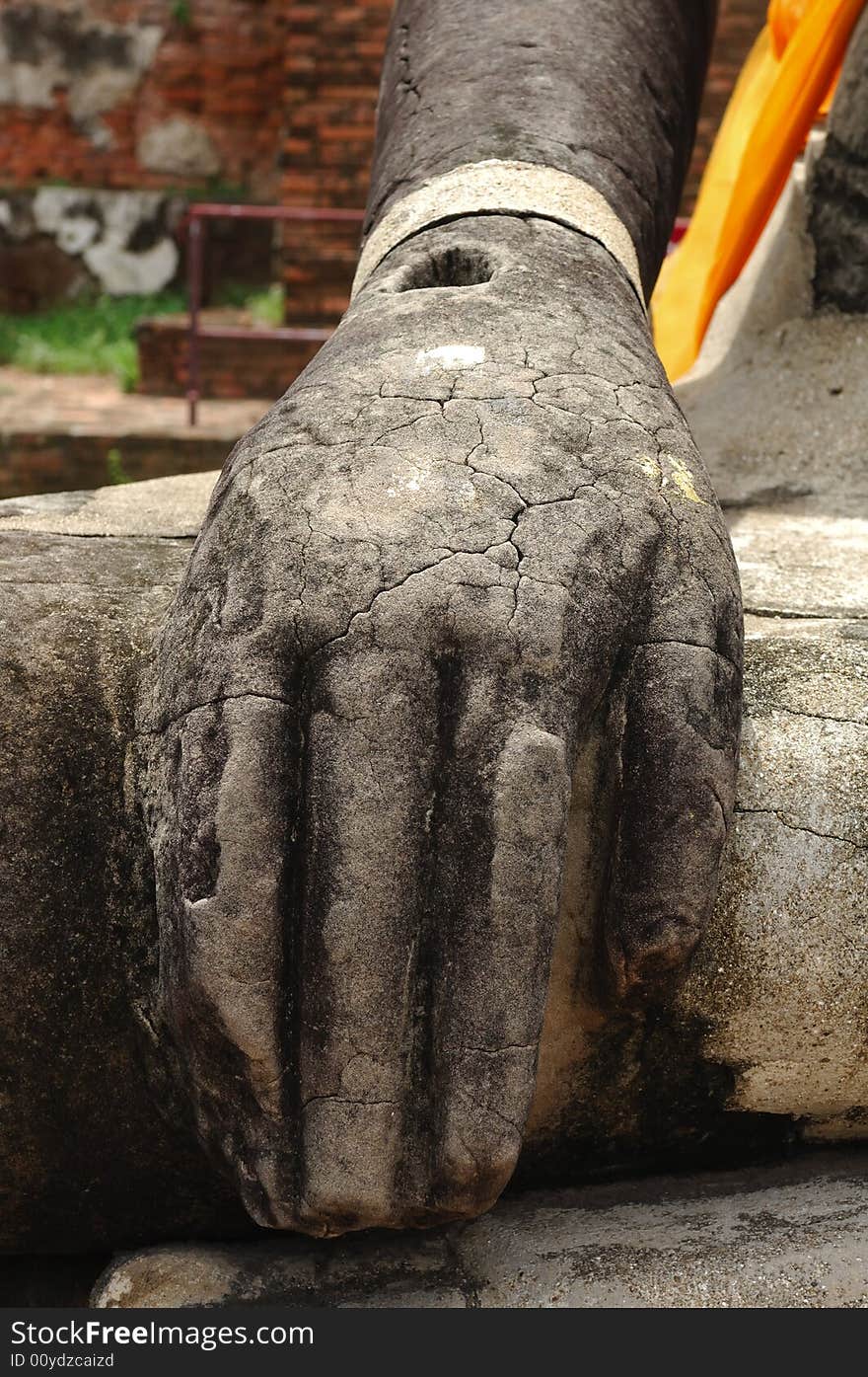 In Thailand the city of Ayutthaya was founded in 1350 today is an impressive archaeological park; here a detail of a seated buddha at the Wat Phra Mahathat. In Thailand the city of Ayutthaya was founded in 1350 today is an impressive archaeological park; here a detail of a seated buddha at the Wat Phra Mahathat