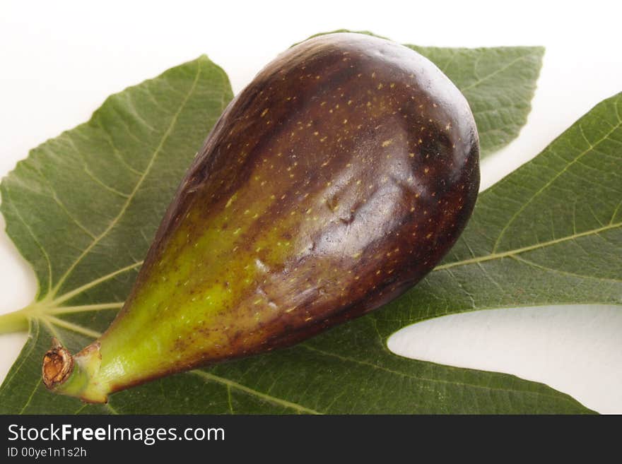 Close up of fresh fig on a leave. Close up of fresh fig on a leave