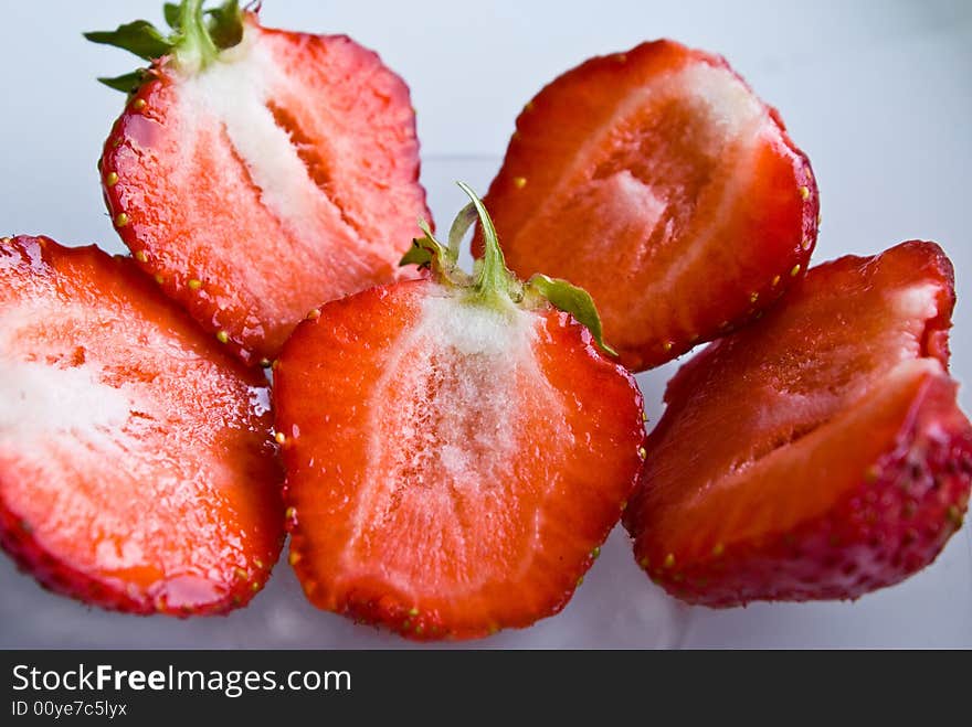 Sliced strawberries on white background. Sliced strawberries on white background