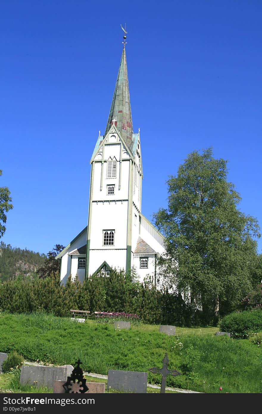 White church and cemetery in Norway