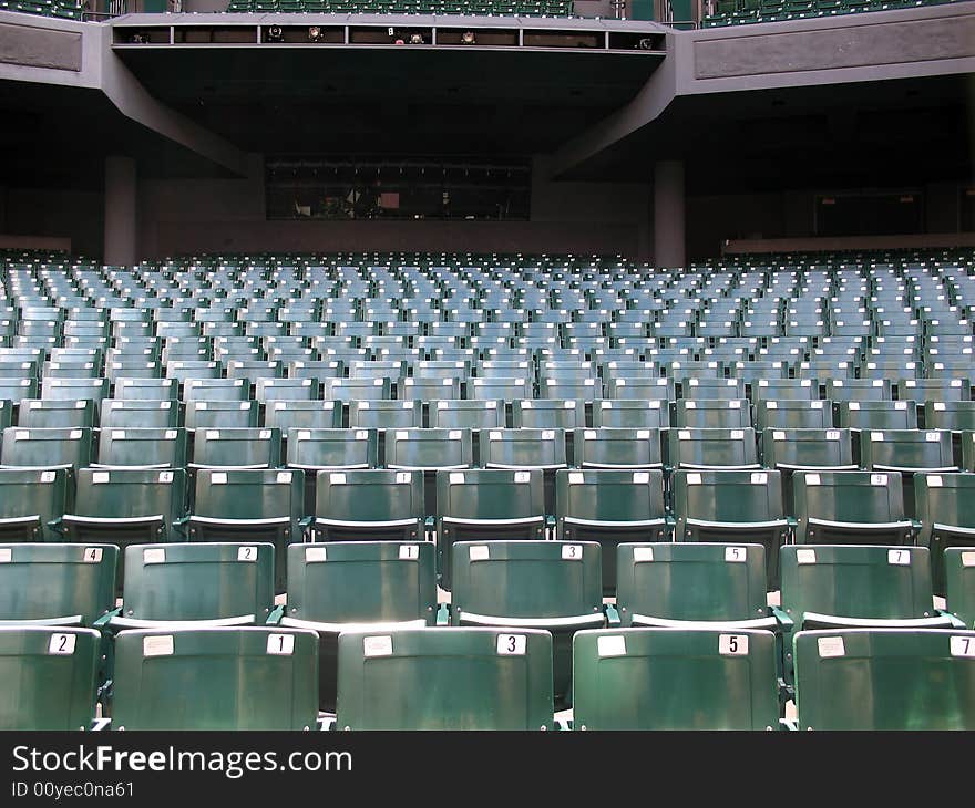 Rows of green folded theater seats