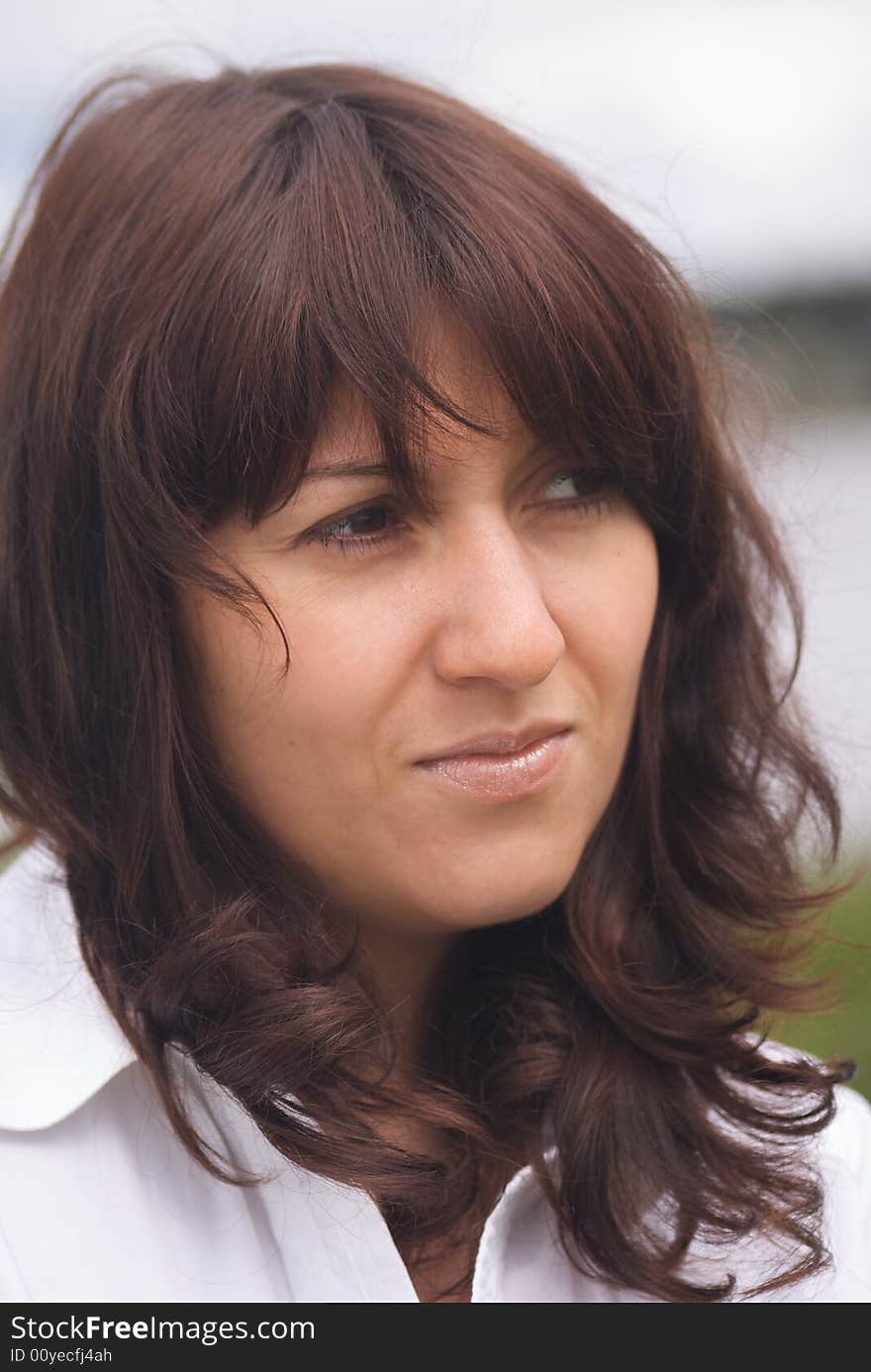 Young beauty woman face with brown hair