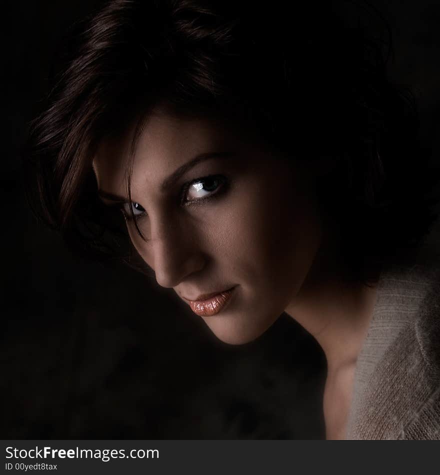 Studio portrait of a pretty brunette lady. Studio portrait of a pretty brunette lady