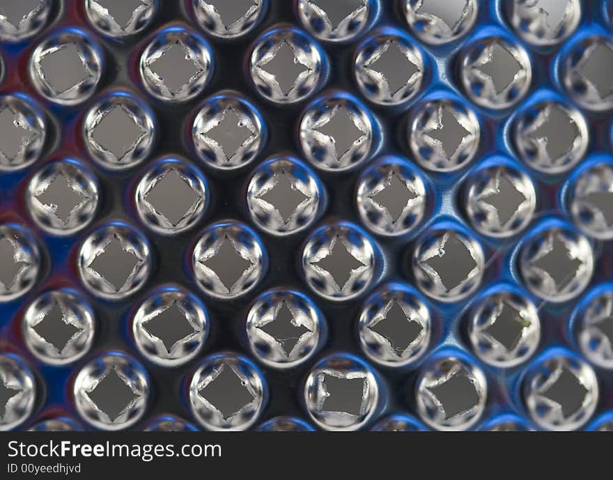 Macro image of a cheese grater blade. Macro image of a cheese grater blade