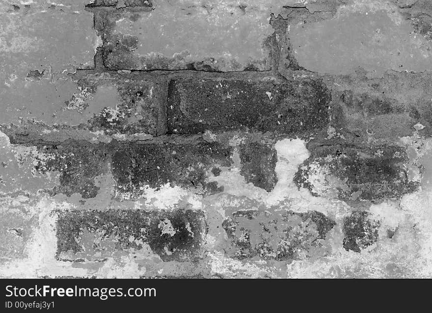 A close-up of a flaking brick wall. A close-up of a flaking brick wall