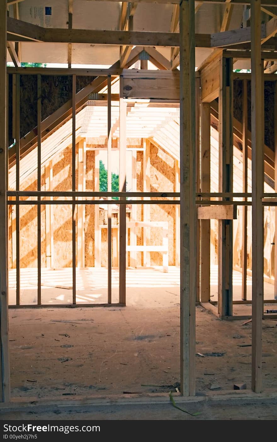 The open upstairs area of a new home with framing for bedroom and closet. The open upstairs area of a new home with framing for bedroom and closet.