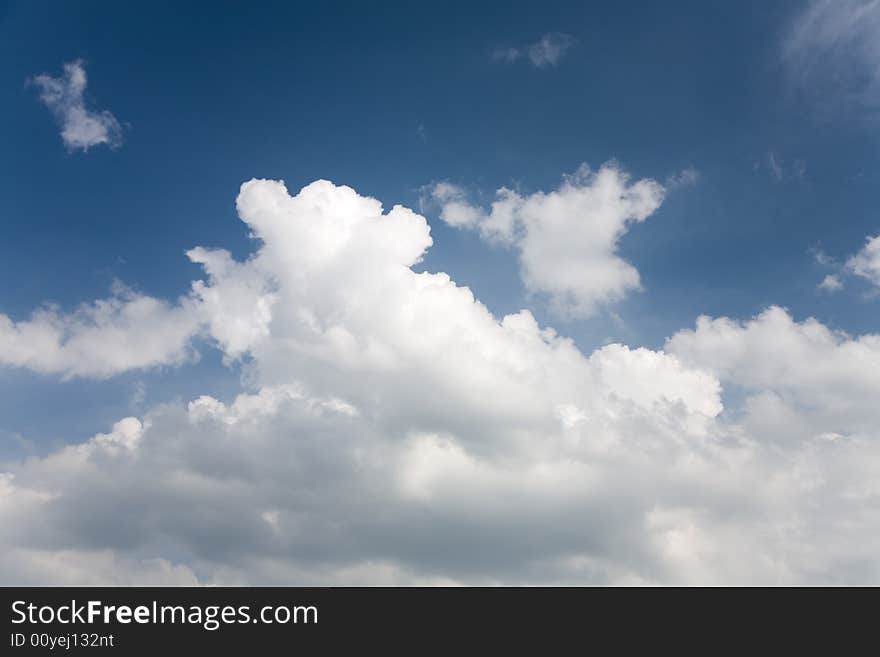 A photo of a sky with some clouds. A photo of a sky with some clouds