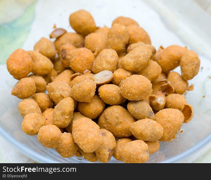 Salted nuts in a glass plate