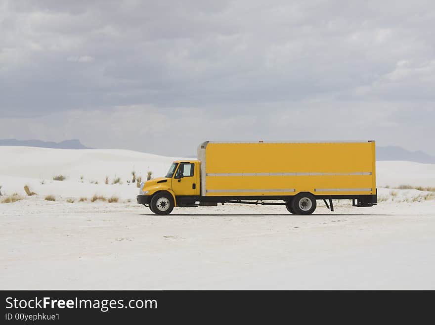 Yellow truck in White Sand Dunes NM - New Mexico.