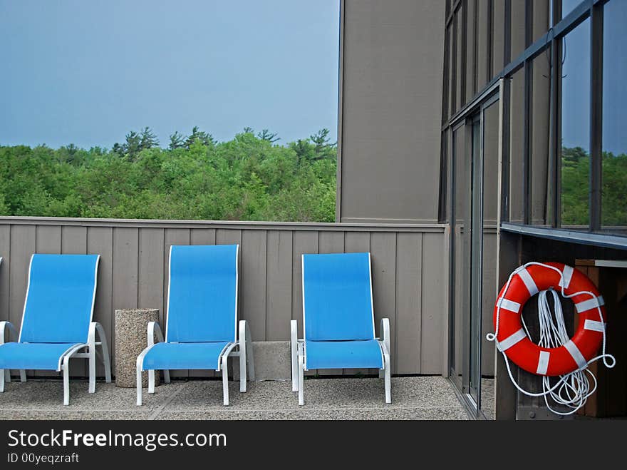 New life ring hanging in the pool area. New life ring hanging in the pool area.