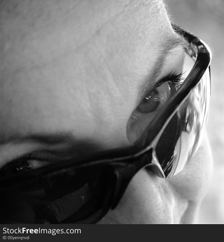 Woman looking over sunglasses