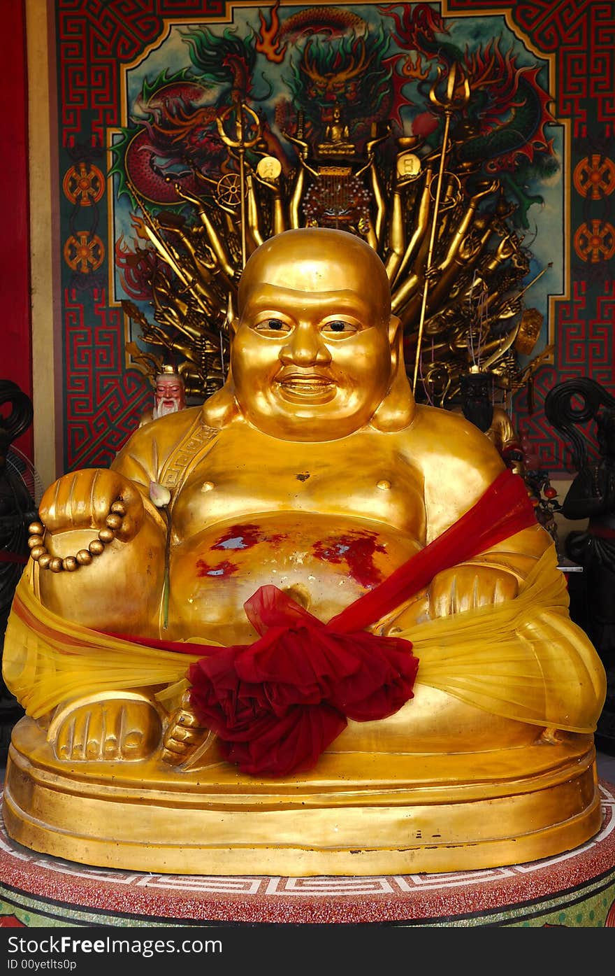 In Thailand the city of Ayutthaya was founded in 1350 today is an impressive archaeological park; here a view of a Chinese Buddha inside a temple on the back of Wat Phanan-Choeng. In Thailand the city of Ayutthaya was founded in 1350 today is an impressive archaeological park; here a view of a Chinese Buddha inside a temple on the back of Wat Phanan-Choeng