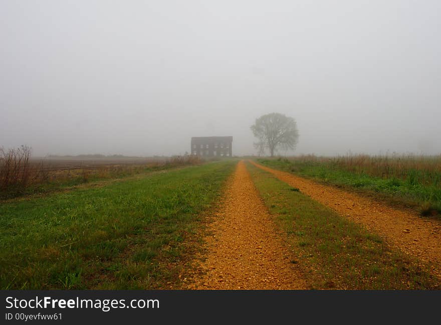 Old farm house on a misty morning