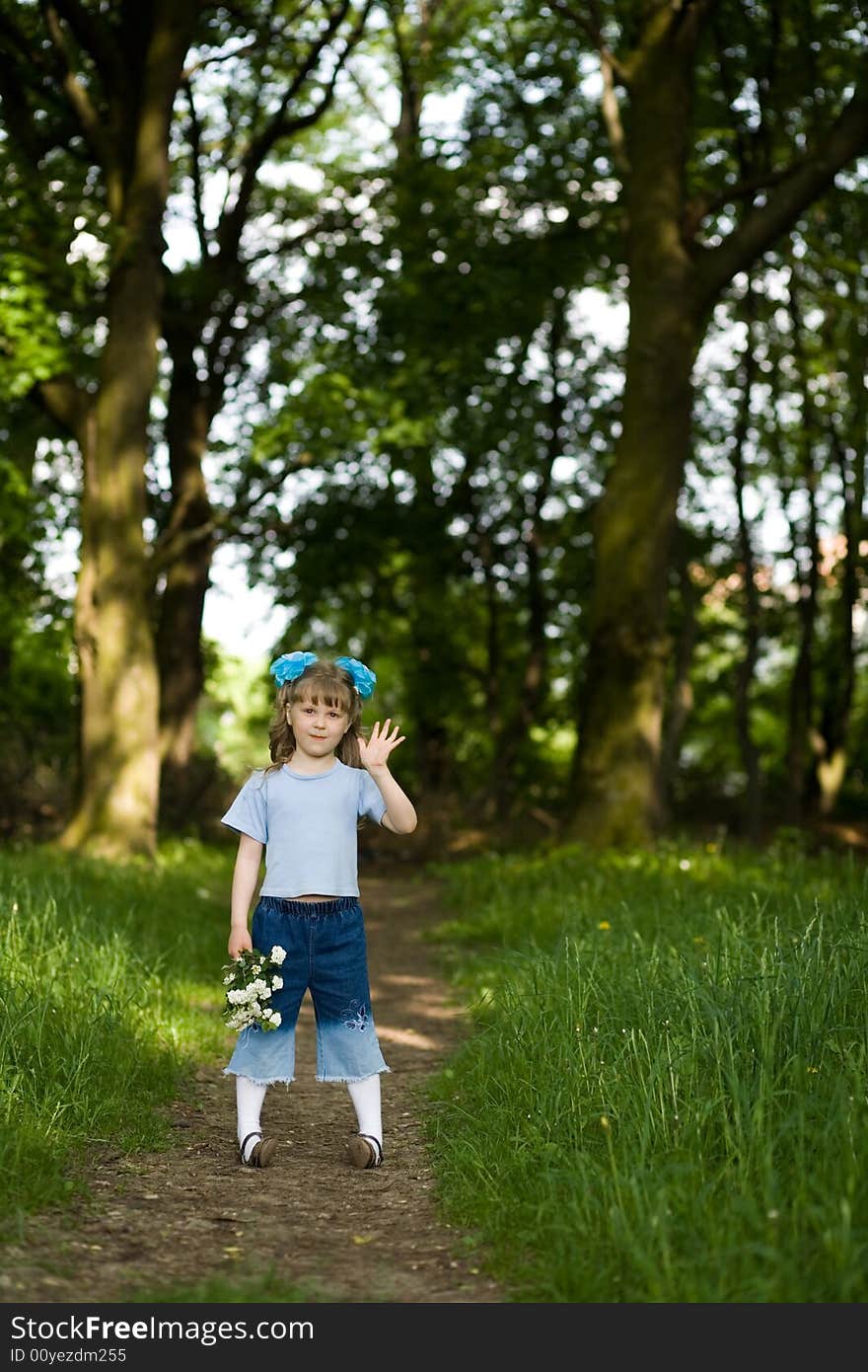 Girl on a lane in the summer park. Girl on a lane in the summer park