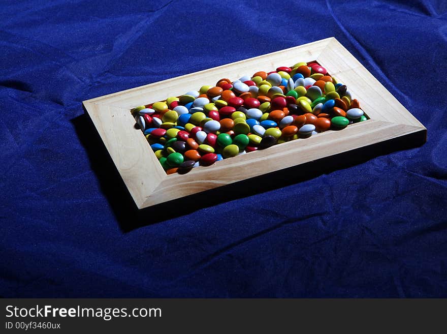 Many colored candies and a frame