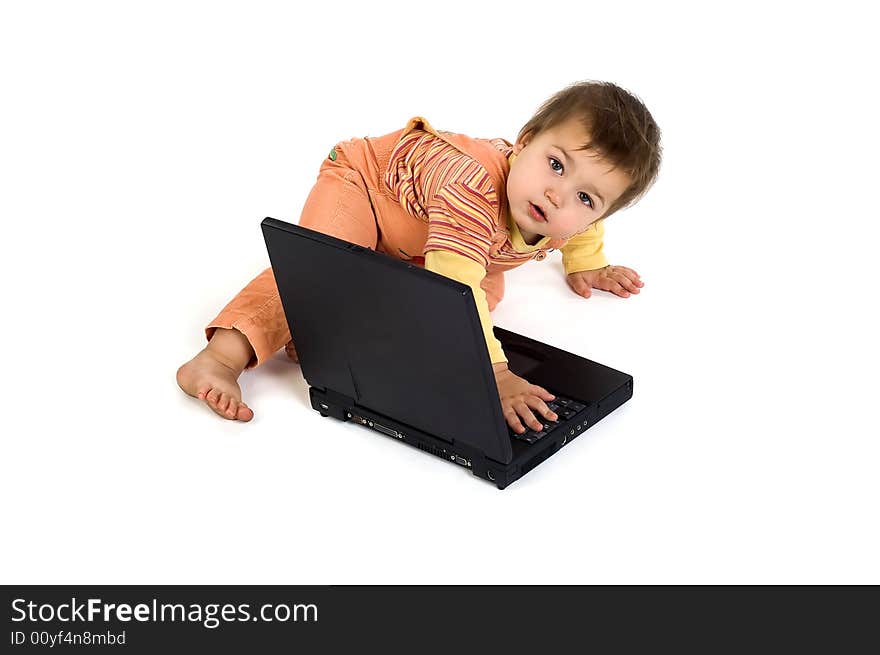 Orange dressed boy working on laptop. Orange dressed boy working on laptop