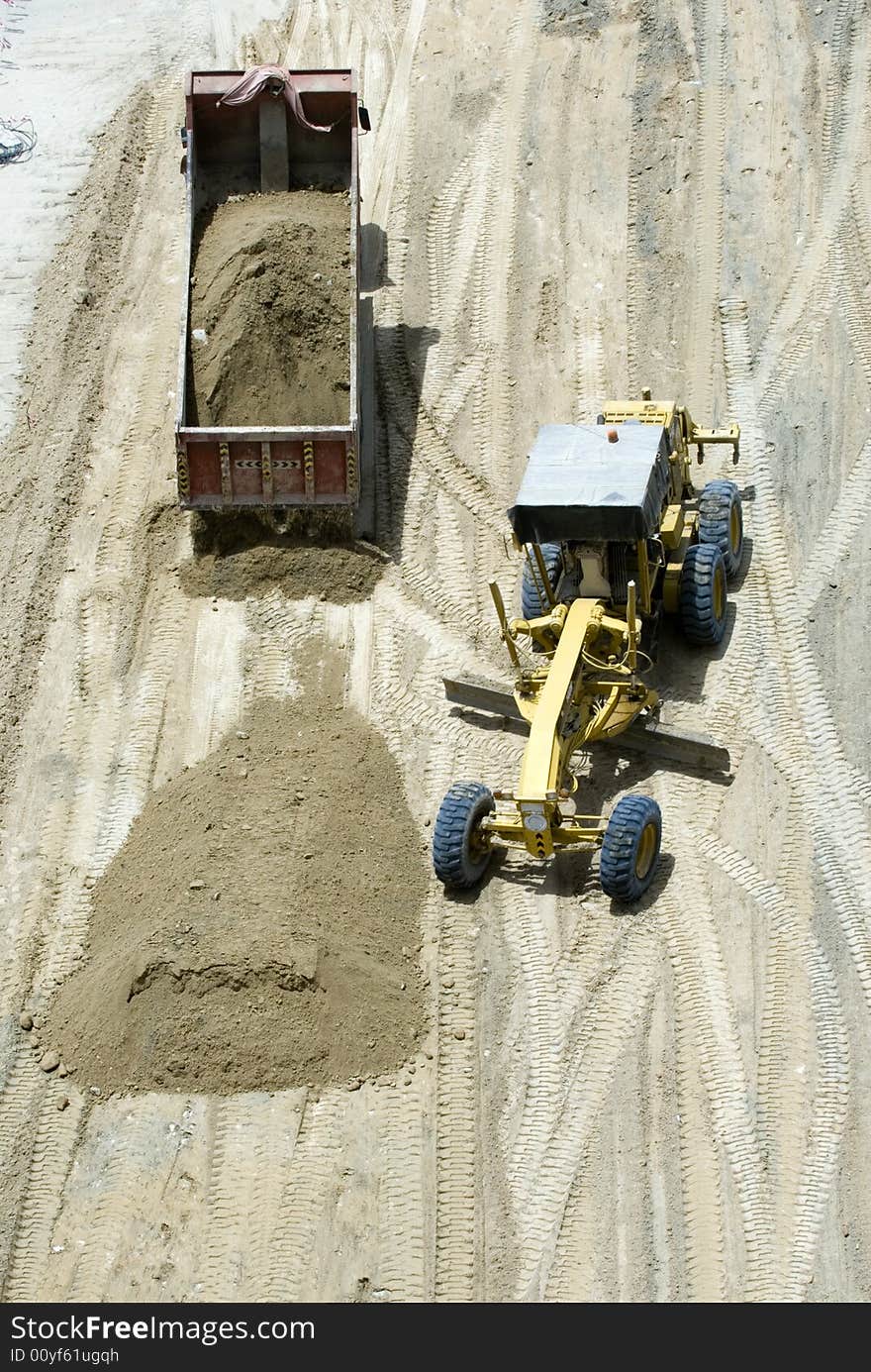 Two construction machinery are beginning to start the base. Two construction machinery are beginning to start the base