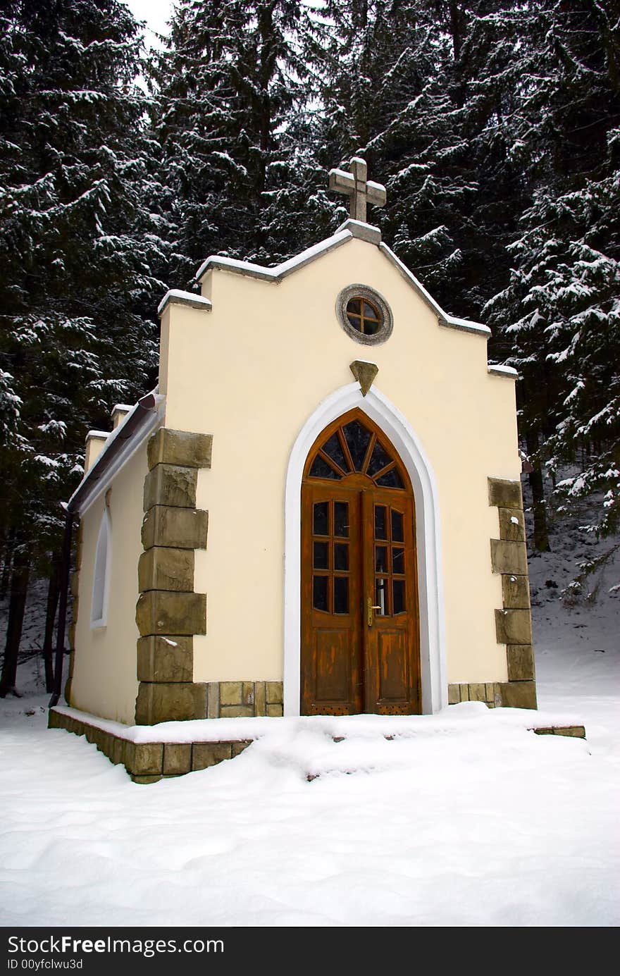 Small chapel in a snow-covered wood. Small chapel in a snow-covered wood