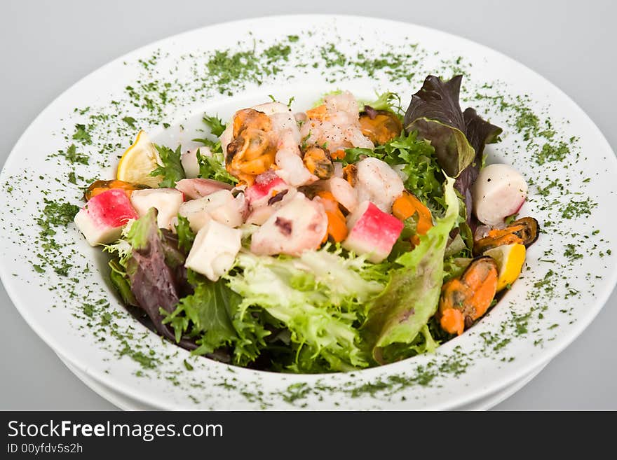 Fresh sea salad with parsley isolated on white