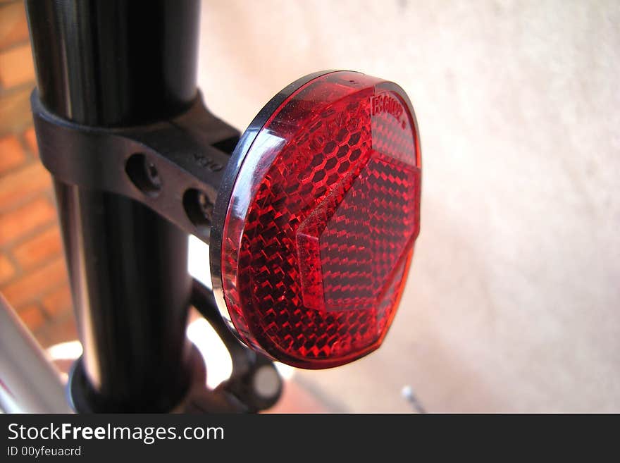 Red bicycle tire and bricks background