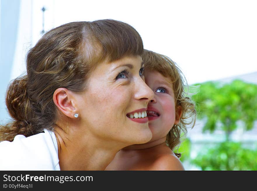 High key portrait of happy mother with baby. High key portrait of happy mother with baby