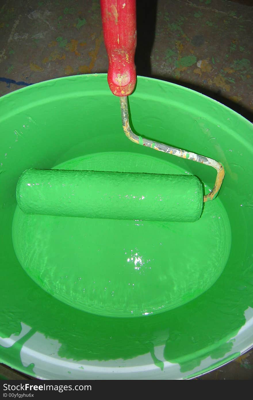 Green paint bucket and roller