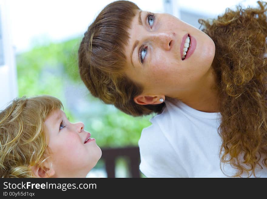 High key portrait of happy mother with baby. High key portrait of happy mother with baby