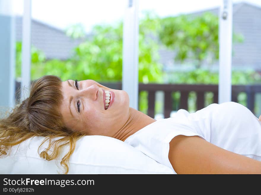 High-key portrait of young blue eyed woman on color back. High-key portrait of young blue eyed woman on color back