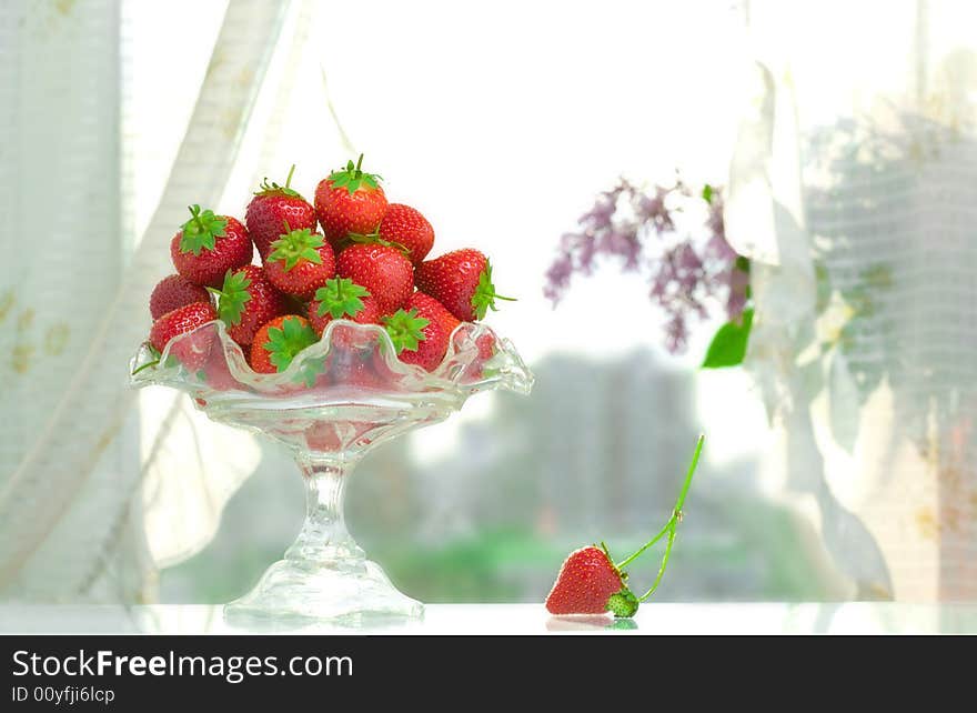 High key photo of fruit dish filled with nice red strawberries. High key photo of fruit dish filled with nice red strawberries