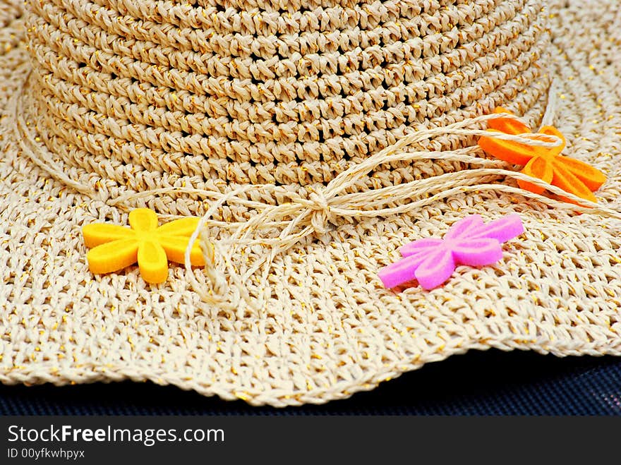 Close up of a sun hat and flowers