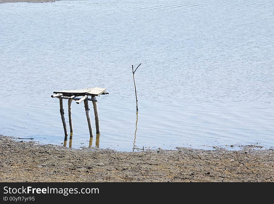 Photo of fisherman sitting ready for action