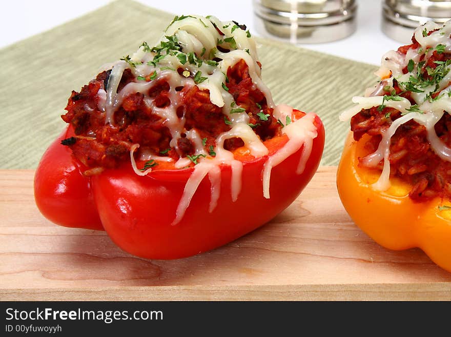 Peppers stuffed with beef, rice, tomato mixture and topped with mozzarella. Peppers stuffed with beef, rice, tomato mixture and topped with mozzarella