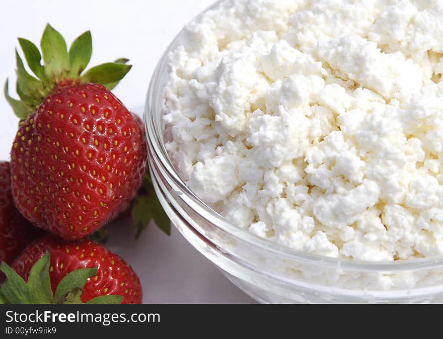 Pot cheese in glass cup and strawberries. Pot cheese in glass cup and strawberries