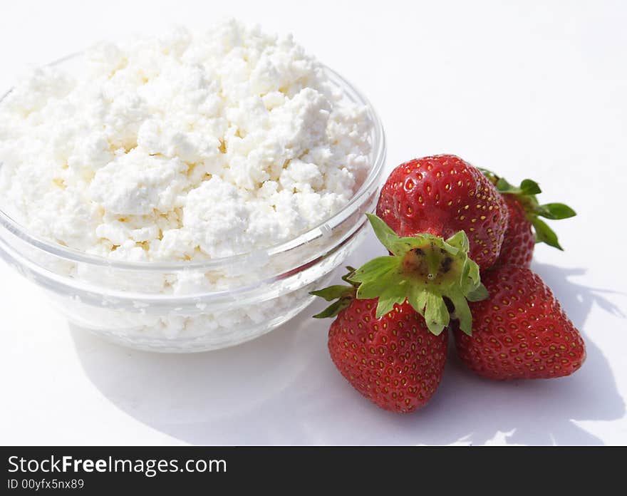 Pot cheese in glass cup and strawberries. Pot cheese in glass cup and strawberries