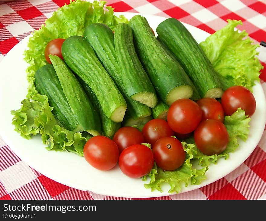 Fresh baby tomatoes and cucumbers. Fresh baby tomatoes and cucumbers.