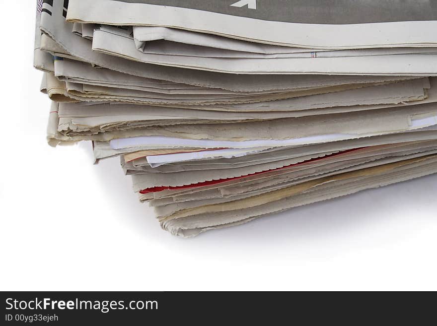 Disorderly pile of the old newspapers