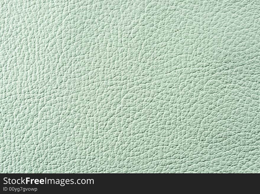 Natural qualitative pistachio green leather texture. Close up. Natural qualitative pistachio green leather texture. Close up.