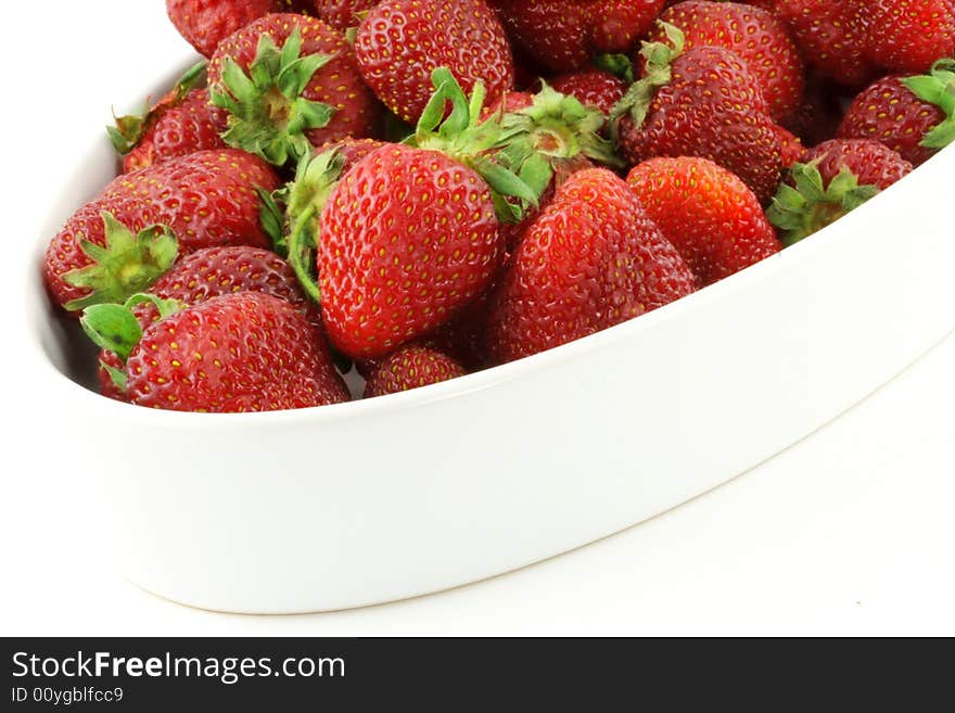 Some fresh strawberries; white background