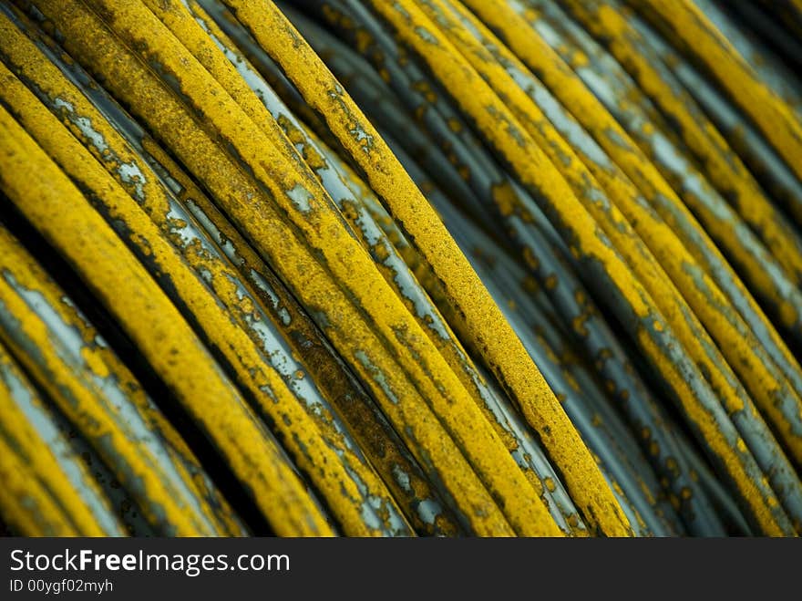 Metallwire on a roll with orange corrotion, closeup.