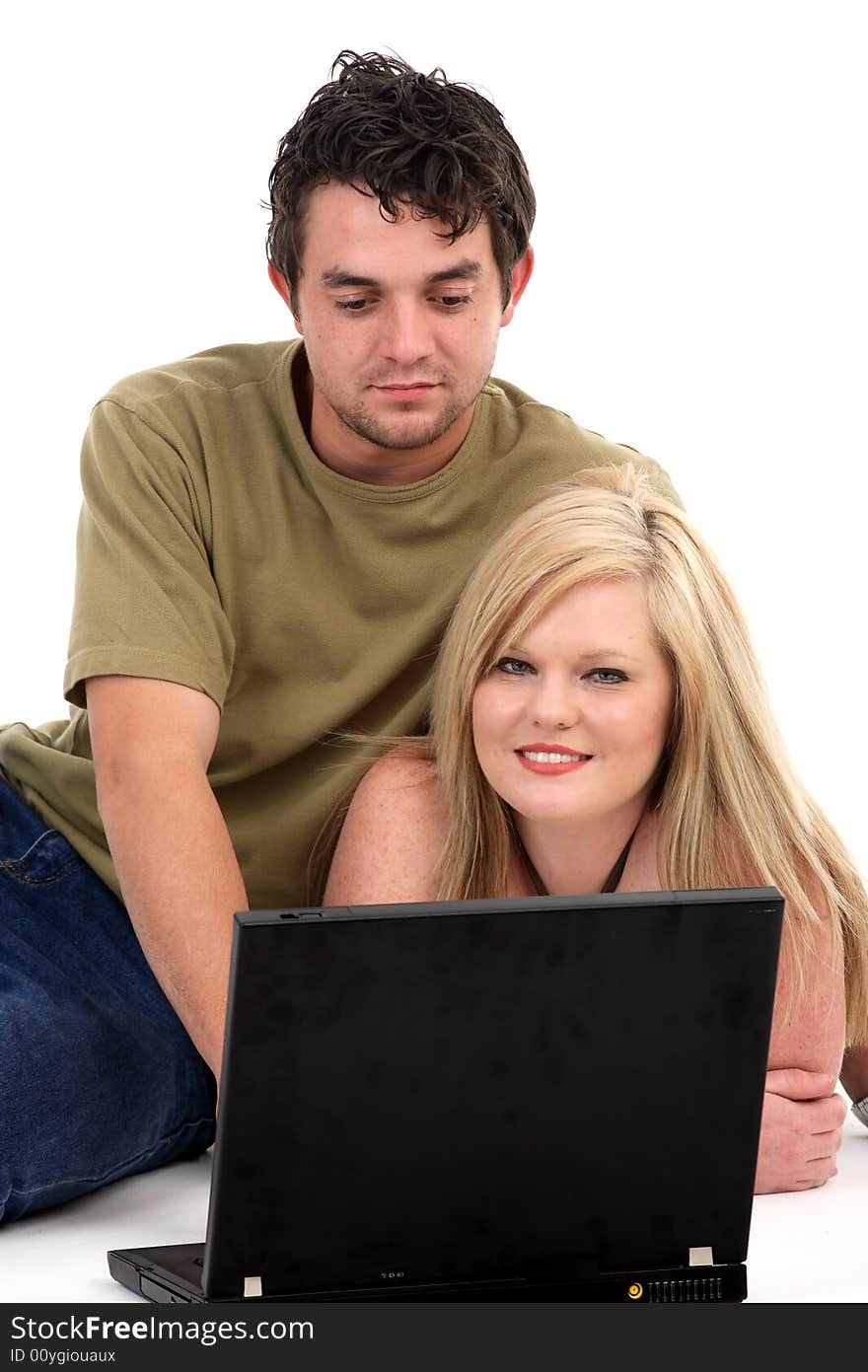 Two student working on a laptop